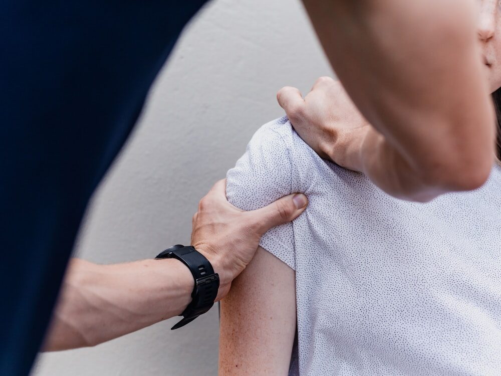 A therapist relieving tension in the neck and shoulders